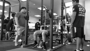 RENOVATED SPACE: Left, a student works out with new weights.