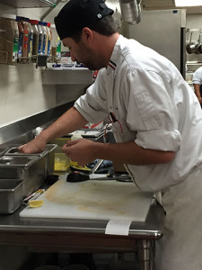 EGG-CELLENT SERVICE: A Culinary Arts student, above, prepares hot and fresh orders for The Student Chef restaurant.  PHOTO BY MIDORI MORITA