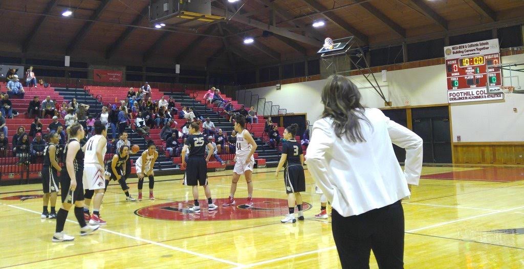 Johnson looks on as team prepares for tip-off against Fresno City College on March 2, 2016. PHOTO BY DELTA WOMEN'S BASKETBALL