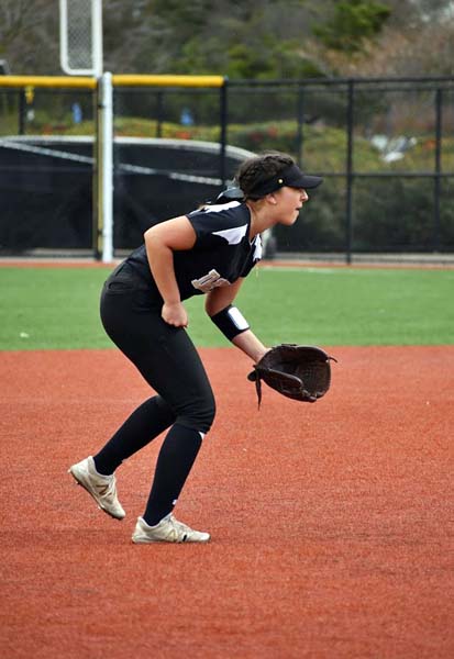 Tawny Deerink goes low for a softball at Delta College on March 3 in Stockton. PHOTO BY EMILY CORDER