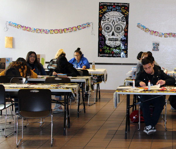 Students participate in the celebration of Dia de los Muertos by stopping by craft stations hosted in lower Danner hall.