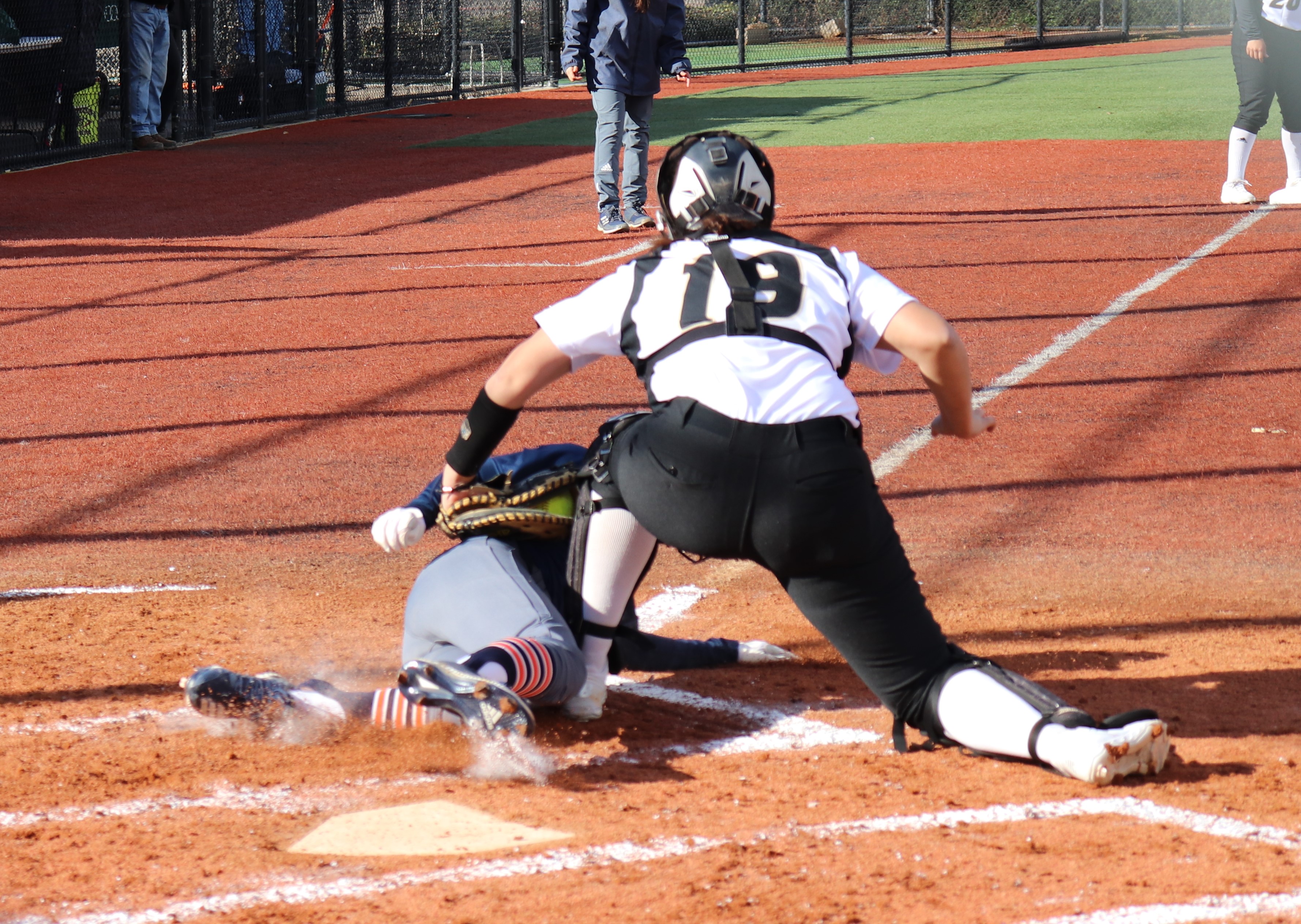 Janelle Rodriguez tags a runner out at home in the third inning. Photo by Paul Muyskens