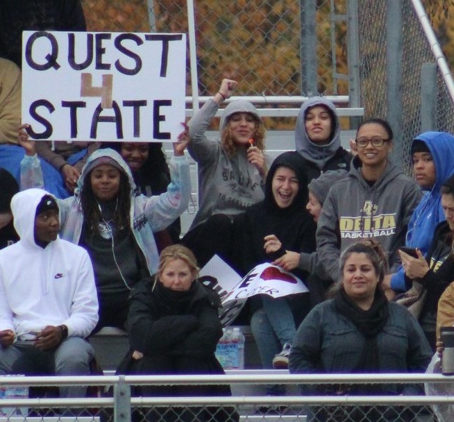 Women's basketball cheering on the women's soccer team from earlier this season during their state championship run.