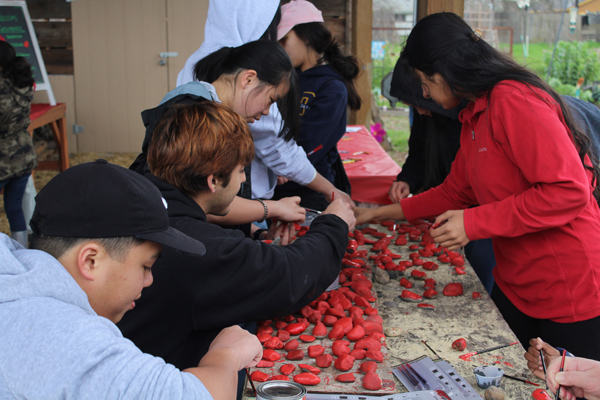 Chavez High School and UOP students volunteer at the rock painting station. Photos by Jaelyn Moralis