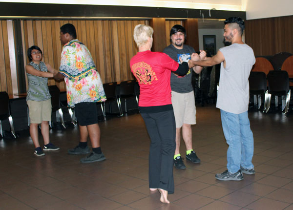 Delta students partner up to practice getting out of a wrist hold at the self defense class sponsored by Delta’s Pride Club for Sexual Assault Awareness month.