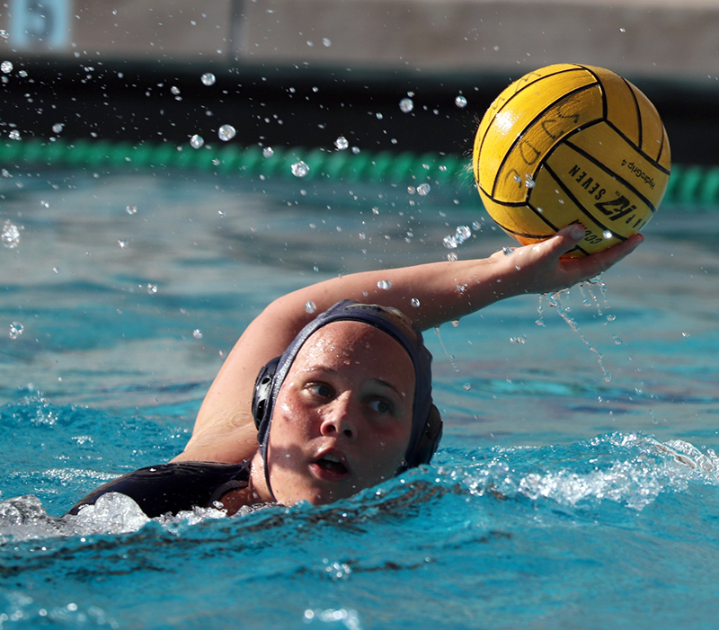 Whitney Lee looks to pass the ball to a teammate. Photo by Paul Muyskens.