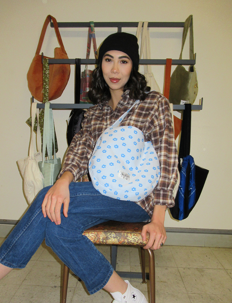 Summer Petitt modeling her Faye inventory in the Faye manufactoring factory.
