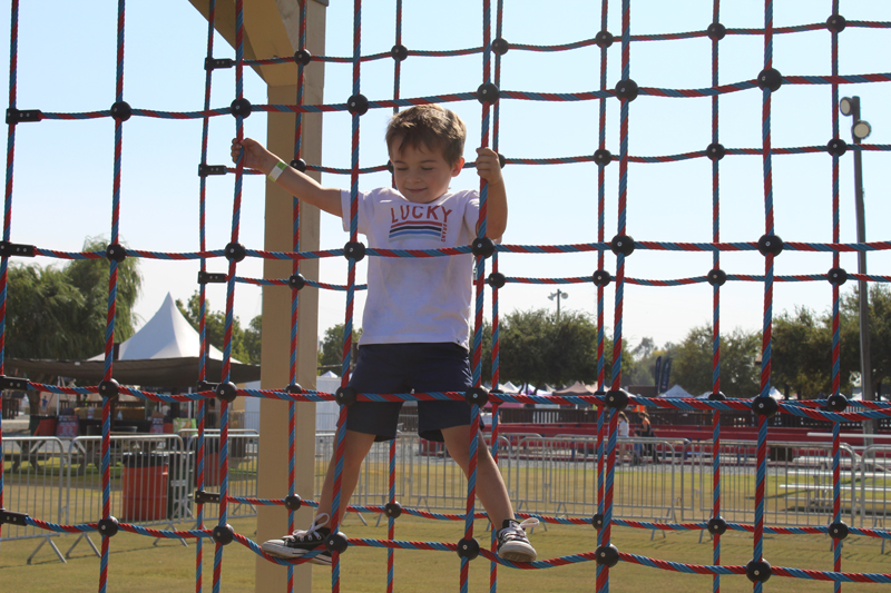 Child playing on obstacle course at Dell’Osso Family Farm on Oct 2. PHOTO BY JAHDAI SPIKES