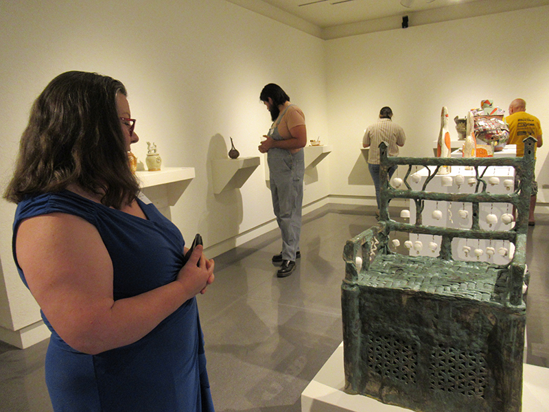 Jenny Lauck and her piece “Wind Throne.” PHOTO BY KAITLYNN BRANDON
