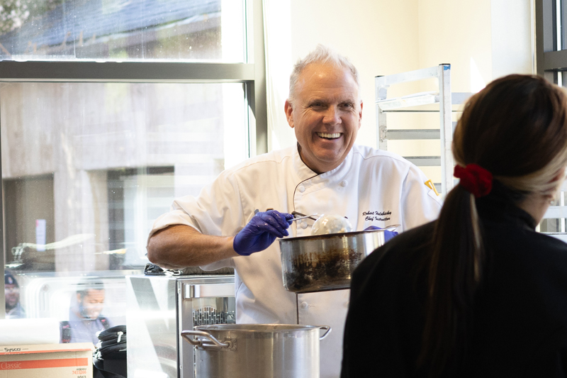 Robert Halabicky, Delta College pastry instructor, prepares corn chowder and grilled cheese sandwiches. As the bakery's facilitator, Halabicky provides hands-on mentorship and support to his student chefs at the Artisan Bakery held on campus in Stockton. PHOTO BY LAYLA CARRASCO