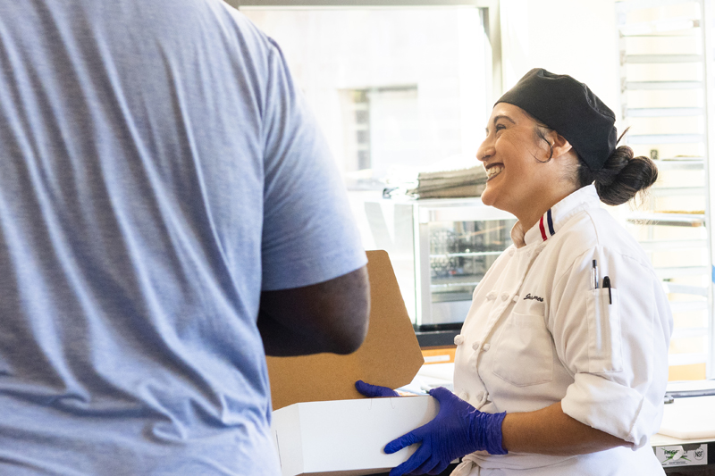 Delta College student Chef, Jasmine Flores, guides customers through the day's freshly baked selections at the Artisan Bakery held on campus in Stockton, Calif. on Nov. 7, 2024. PHOTO BY LAYLA CARRASCO