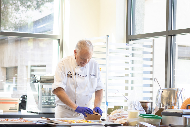 Robert Halabicky, Delta College pastry instructor, prepares corn chowder and grilled cheese sandwiches. As the bakery's facilitator, Halabicky provides hands-on mentorship and support to his student chefs at the Artisan Bakery held on campus in Stockton. PHOTO BY LAYLA CARRASCO