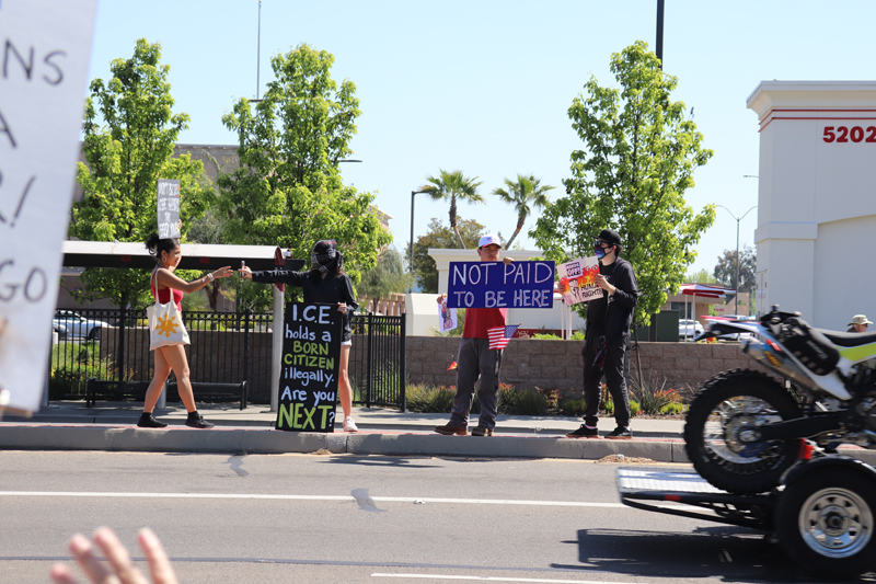 Protesters on the center divider of the Pacific avenue
